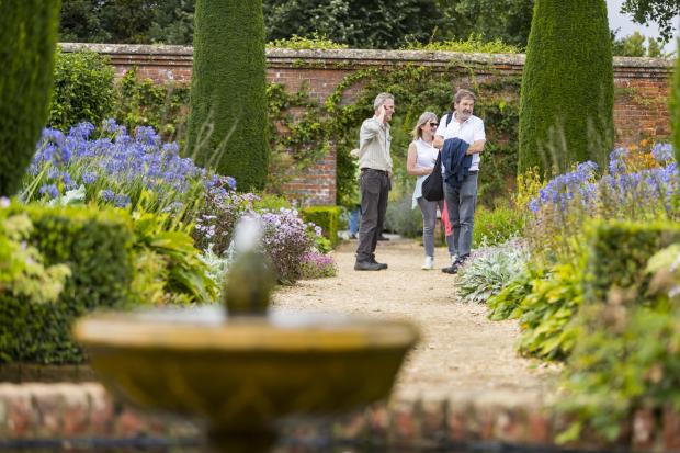 Basingstoke Gazette: Visitors on a garden tour at Mottisfont, Hampshire